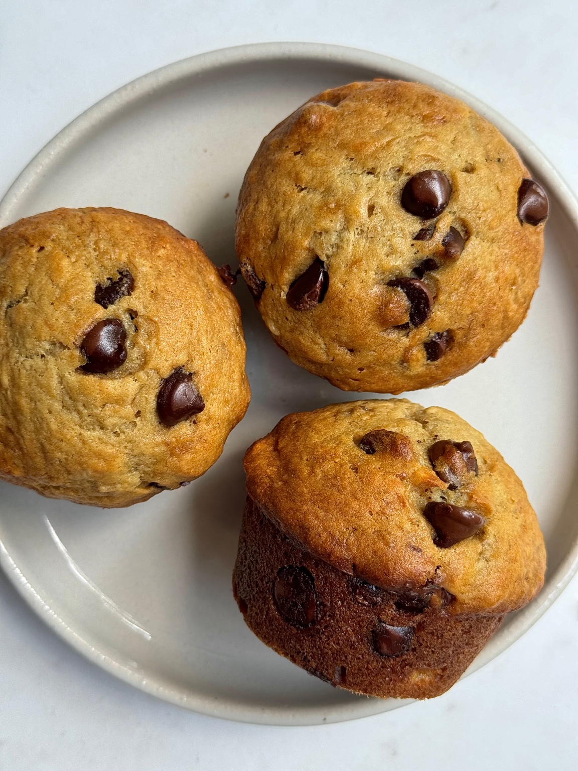 Banana chocolate chip muffins on a plate