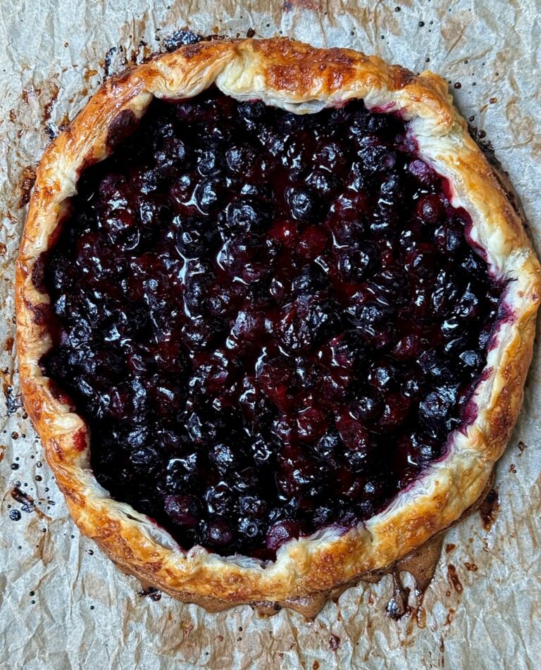 Rustic blueberry galette with puff pastry and juicy blueberry filling.